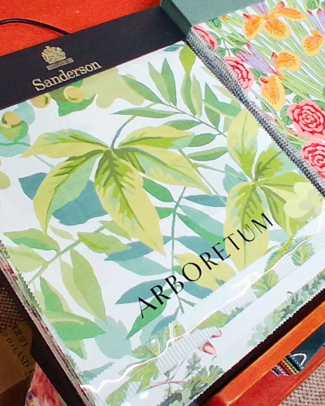 Natural upholstery fabric samples — linen, velvet, and wool — at the Savery's showroom